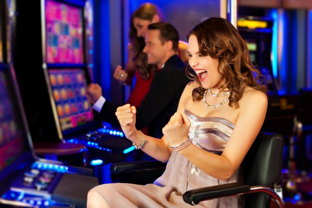 Woman-Enjoys-Playing-Slots-640x426 Woman-Enjoys-Playing-Slots